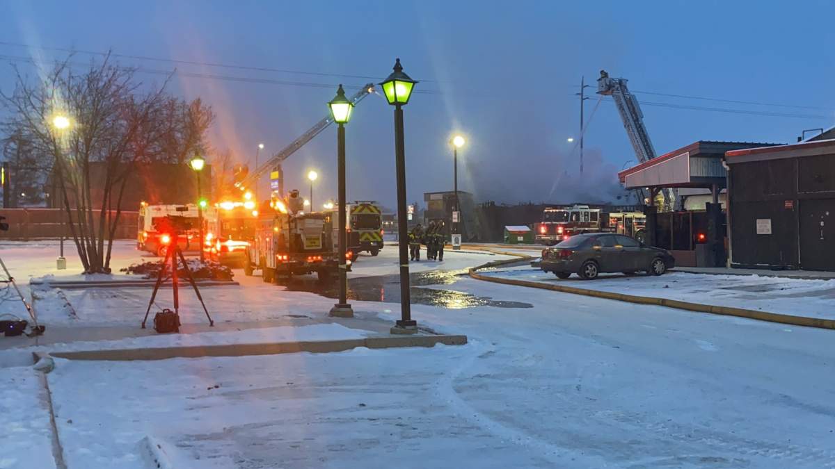 Calgary firefighters battle a blaze at a restaurant in the area of 96 Avenue and Macleod Trail S.W. Monday, Dec. 6, 2021.