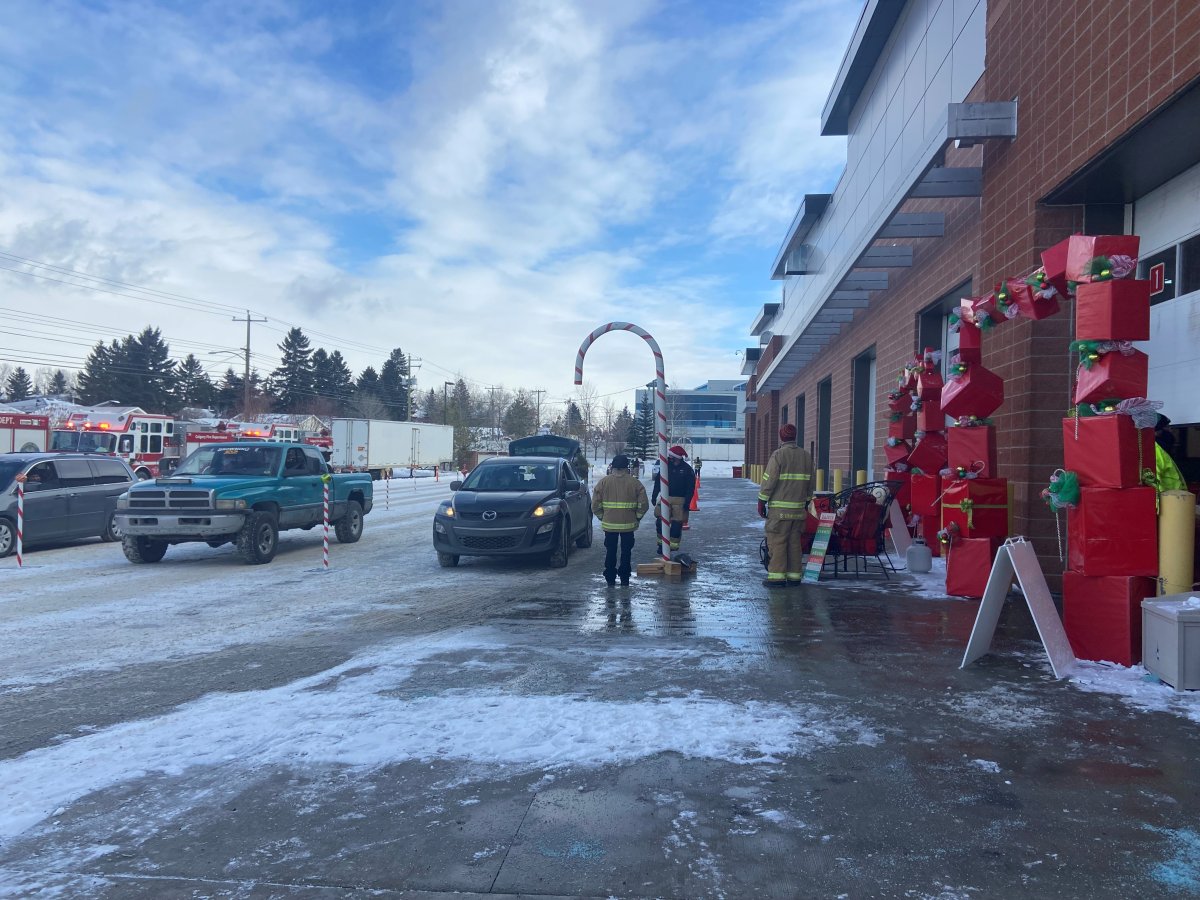 Firefighters drive through toy drive in Calgary 2021.
