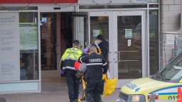 Paramedics transfer a person from an ambulance into a hospital, amid the global COVID-19 pandemic, in Montreal, Saturday,