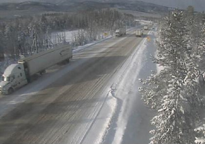 A traffic camera on Highway 3 shows trucks and snowy conditions on Sunday. 