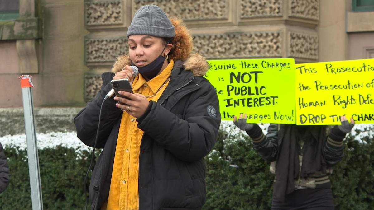 Kate MacDonald, a housing advocate, and a community activist spoke during the rally.