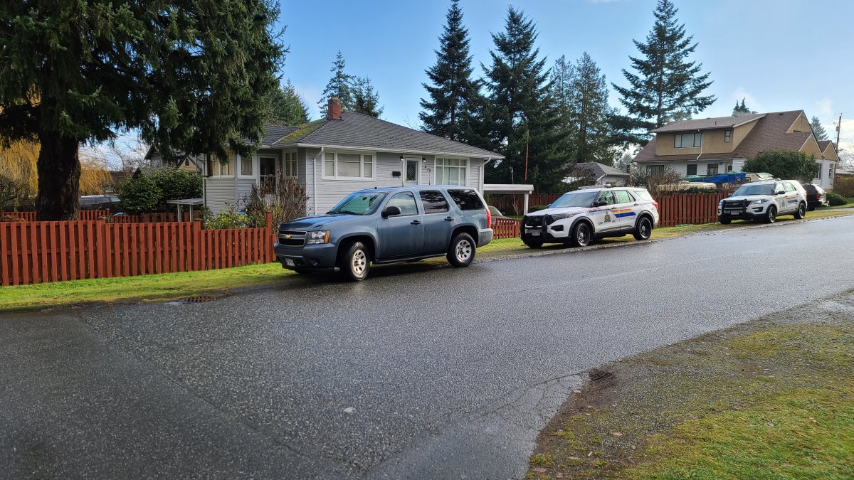 A police vehicle is seen outside the Nanaimohome where two people in their 60s were stabbed on Saturday night. 