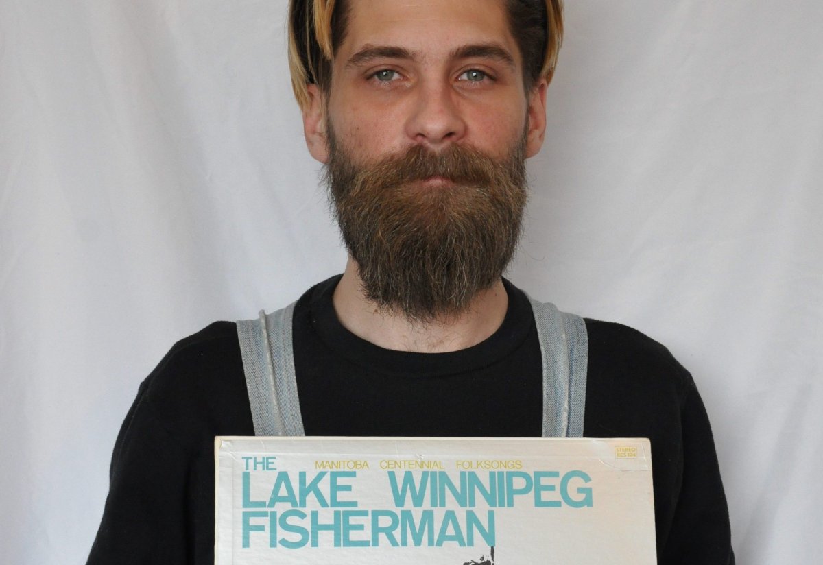 Scott Petrowski, seen here with an original copy of 'The Lake Winnipeg Fisherman,' is reissuing the Gimli classic for new listeners.