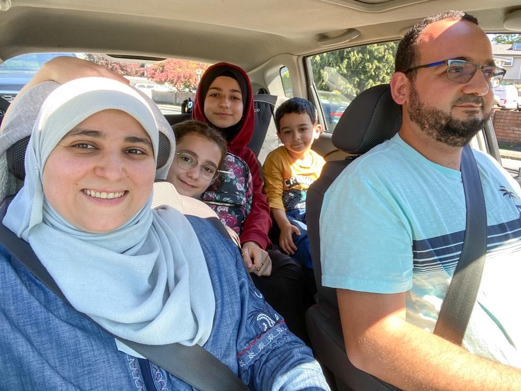 Asmaa Ghadban, pictured with her husband and three children.