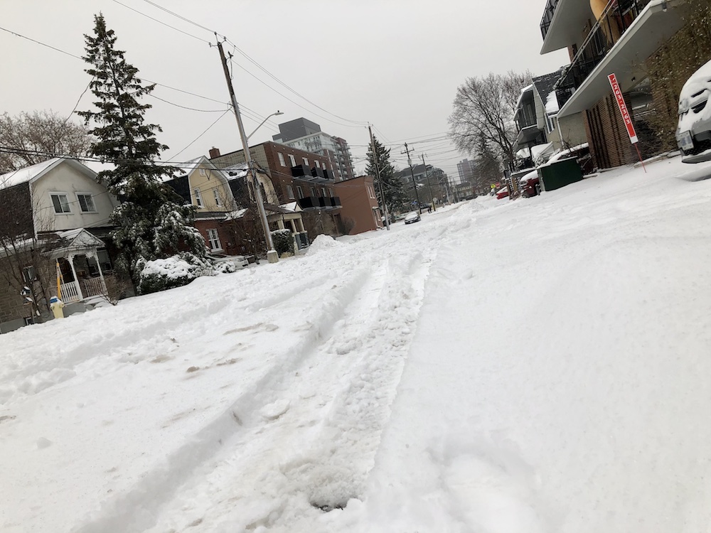 Snow-lined streets in Ottawa on Dec. 6, 2021 before the forecasted freezing rain hits.