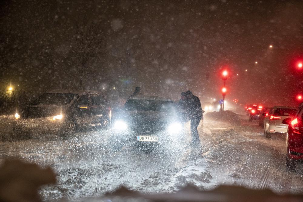 A snowstorm causes chaos on the roads around Aalborg, Denmark, Wednesday Dec. 1, 2021.