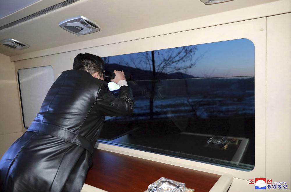This photo provided by the North Korean government shows North Korean leader Kim Jong Un watches what it says a test launch of a hypersonic missile on Jan. 11, 2022 in North Korea. Independent journalists were not given access to cover the event depicted in this image distributed by the North Korean government. The content of this image is as provided and cannot be independently verified. Korean language watermark on image as provided by source reads: \”KCNA\” which is the abbreviation for Korean Central News Agency. (Korean Central News Agency/Korea News Service via AP)