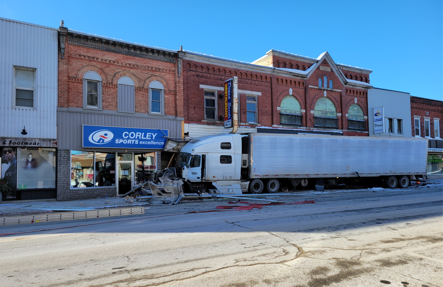 No one was seriously injured Friday after a transport truck left the roadway and struck two businesses in downtown Listowel, Ont.