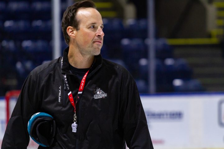 Kelowna Rocket head coach Kris Mallette looks on during practice.