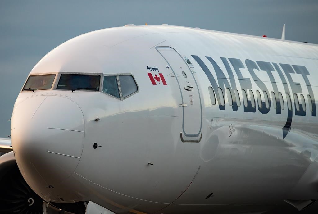 A WestJet Airlines Boeing 737 Max aircraft taxis to a gate after arriving at Vancouver International Airport in Richmond, B.C., Thursday, Jan. 21, 2021. The B.C. Court of Appeal has rejected WestJet's efforts to overturn the certification of a class-action lawsuit on baggage fees. 