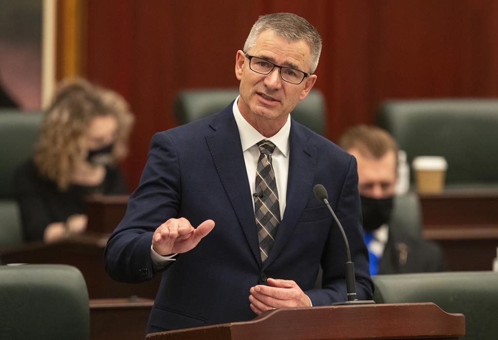 Now former Alberta Minister of Finance Travis Toews delivers the 2021 budget in Edmonton on Thursday, Feb. 25, 2021.