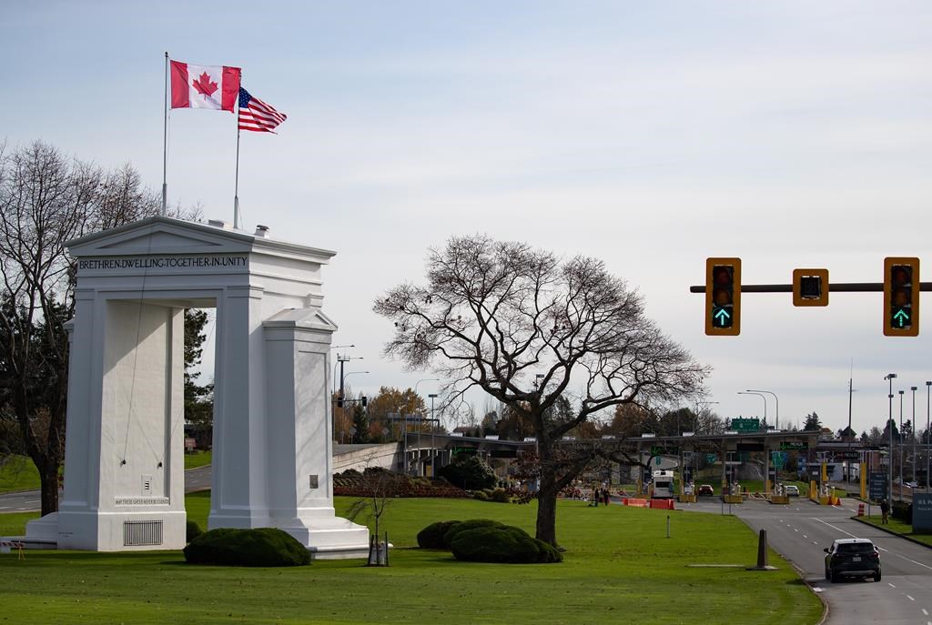 Motorists wait at U.S. Customs and Border Protection inspection booths at the Peace Arch border crossing in Blaine, Wash., across the Canada-U.S. border from Surrey, B.C., on Monday, Nov. 8, 2021.Border and travel exemptions put in place after a series of devastating storms hit British Columbia will end next week.