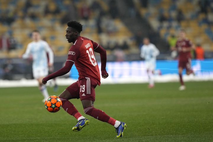 Bayern’s Alphonso Davies controls the ball during the Champions League group E soccer match between Dynamo Kyiv and Bayern Munich, at the Olimpiyskiy Stadium in Kyiv, Ukraine, Tuesday, Nov. 23, 2021.