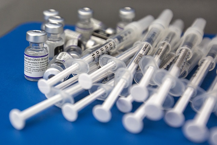 Vaccine vial and syringes are seen at a COVID vaccine clinic in Kingston, Ontario on Saturday December 18, 2021.