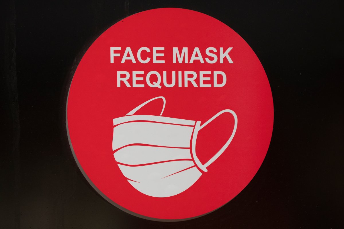 A sign advising people to wear face masks in Kingston, Ontario on Monday, December 28, 2020, as the COVID-19 pandemic continues across Canada and around the world. THE CANADIAN PRESS IMAGES/Lars Hagberg.