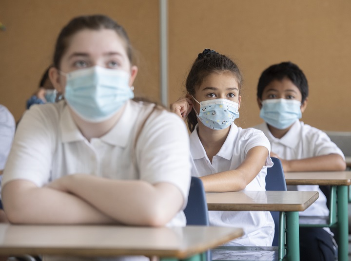 Students wear face masks as they attend class on the first day of school in Montreal, Tues. Aug. 31, 2021, as the COVID-19 pandemic continues in Canada and around the world.