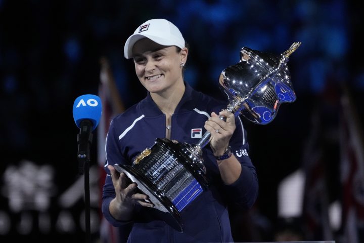 Ash Barty of Australia holds the Daphne Akhurst Memorial Cup after defeating Danielle Collins of the U.S in the women's singles final at the Australian Open tennis championships in Melbourne, Australia, Saturday, Jan. 29, 2022.