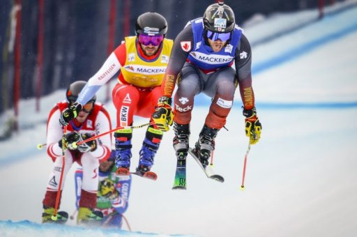 Canada’s Kevin Drury, right, leads Switzerland’s Joos Berry, centre, and Austria’s Tristan Takats over a jump during the men’s quarter-final at the World Cup ski cross event at Nakiska Ski Resort in Kananaskis, Alta., Friday, Jan. 14, 2022.