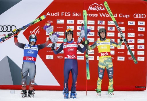 Sweden’s David Mobaerg, centre, celebrates his victory with second place finisher Canada’s Kevin Drury, left, and third place finisher Germany’s Tobias Mueller, following the men’s final at the World Cup ski cross event at Nakiska Ski Resort in Kananaskis, Alta., Friday, Jan. 14, 2022.
