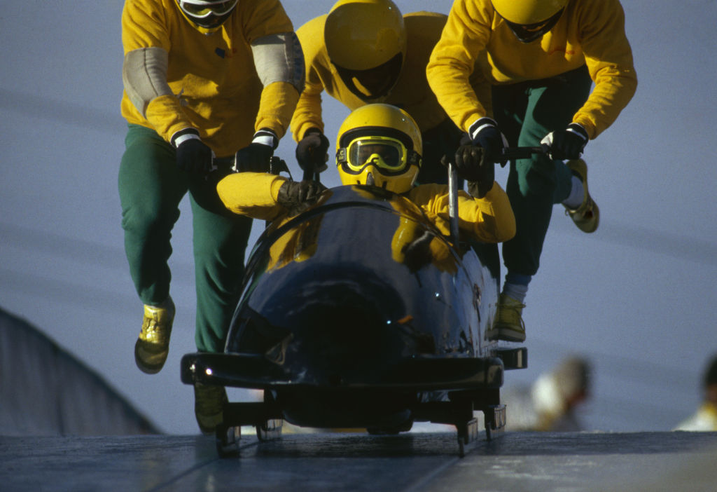 The Jamaican bobsled team pushed a sled down the track in Calgary during the 1988 Olympics