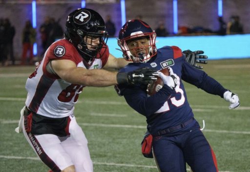 Montreal Alouettes running back Martese Jackson tries to get past Ottawa Redblacks fullback Marco Dubois on a kick return during first quarter CFL football action in Montreal on Friday, November 19, 2021.