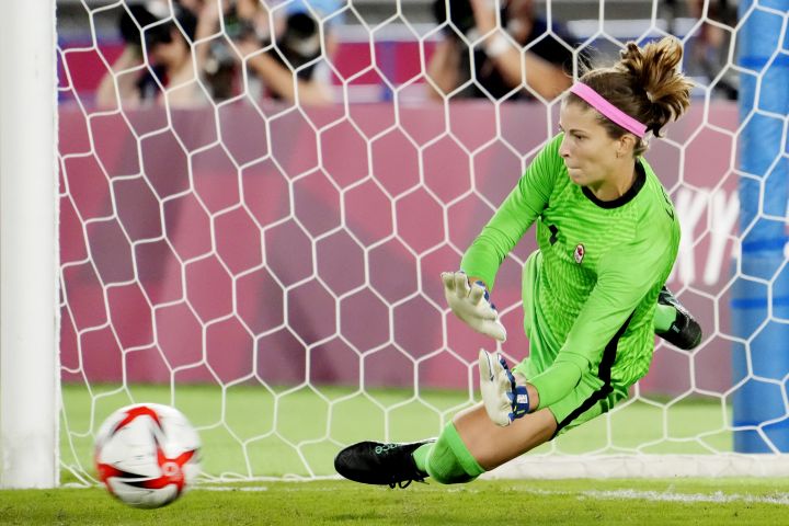 Canada's Stephanie Labbe makes a save against Sweden in the sixth round of the penalty shoot-out in the women's soccer final during the summer Tokyo Olympics in Yokohama, Japan on Friday, August 6, 2021. 