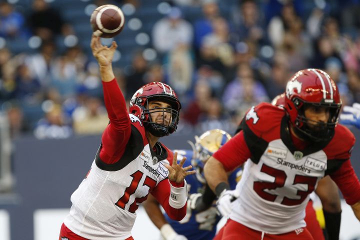 Calgary Stampeders quarterback Jake Maier (12) throws against the Winnipeg Blue Bombers during first half CFL football action in Winnipeg, Sunday, Aug. 29, 2021. 