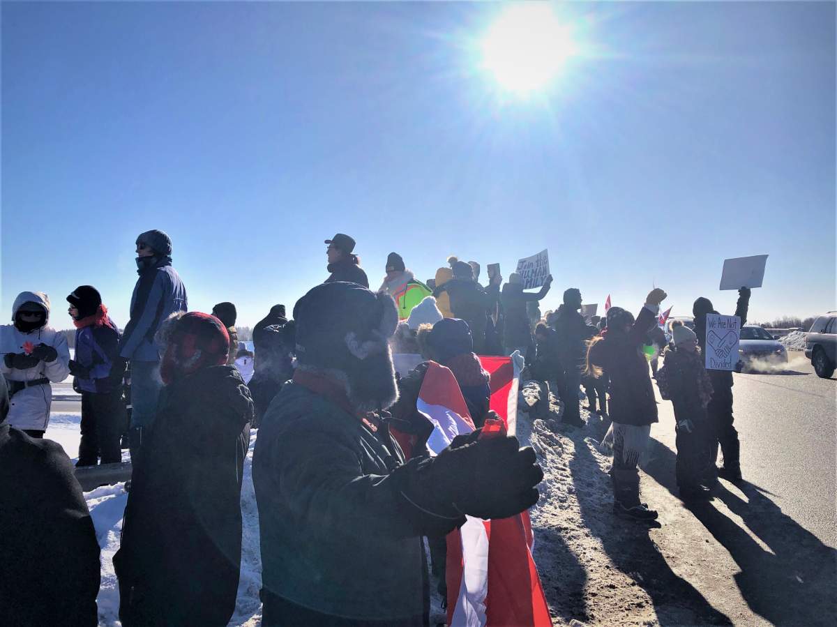 Supporters of the truckers’ “freedom convoy” are seen gathered in Moncton to protest vaccine mandates.