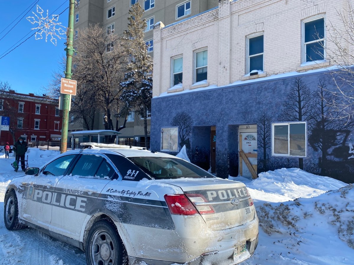 A Winnipeg police car outside an apartment building on Main Street on Wednesday, Jan. 19, 2022.