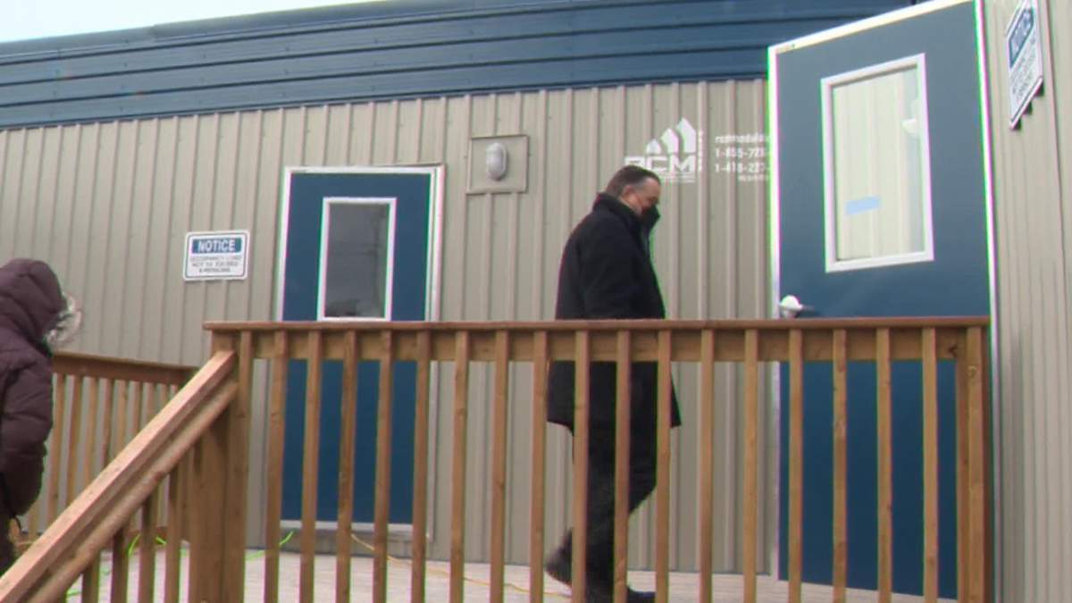 Halifax Mayor Mike Savage takes part in a tour of modular units in Dartmouth on Jan. 11, 2022.