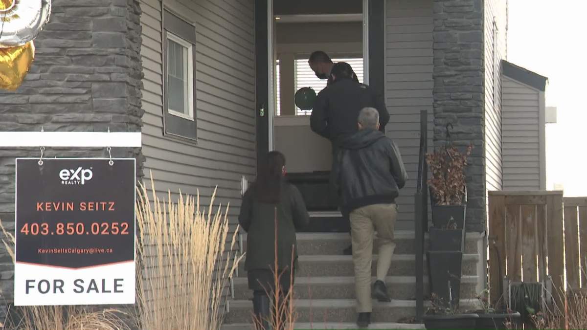 Calgary realtor shows prospective home buyers home for sale