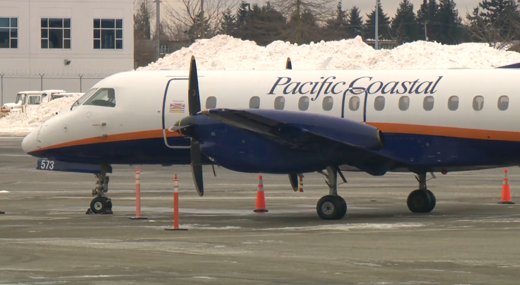 A Pacific Coastal Airlines plane is seen at Vancouver International Airport on Sat. Jan. 1, 2022.