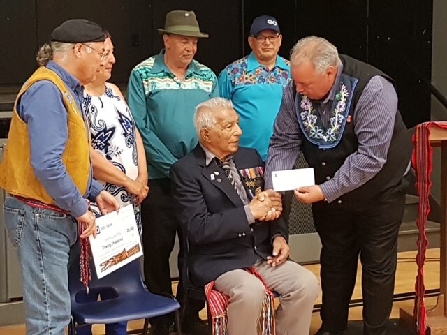 Louis Roy is seen receiving recognition and a cheque from the Manitoba Metis Federation in a 2019 handout photo. Roy, who died Jan. 11. 2022, Tuesday at a long-term care home in northern Saskatchewan, was one of the oldest veterans of the Second World War.