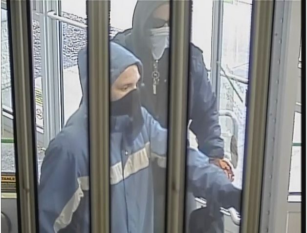Video surveillance images show the two suspects involved in a robbery outside the TD bank at Peakview Way in Bedford, N.S. on Jan. 1, 2022. 