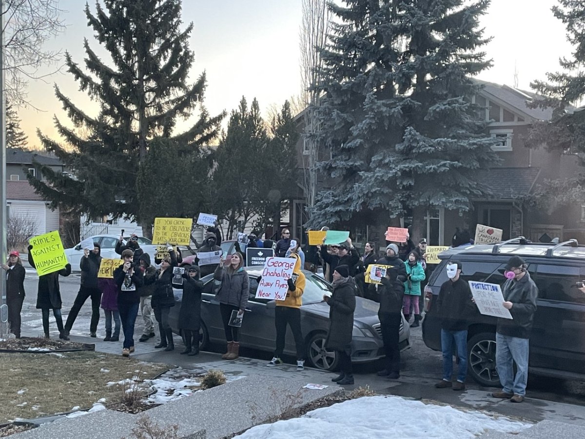 Protesters gather outside the home of Calgary MP George Chahal.