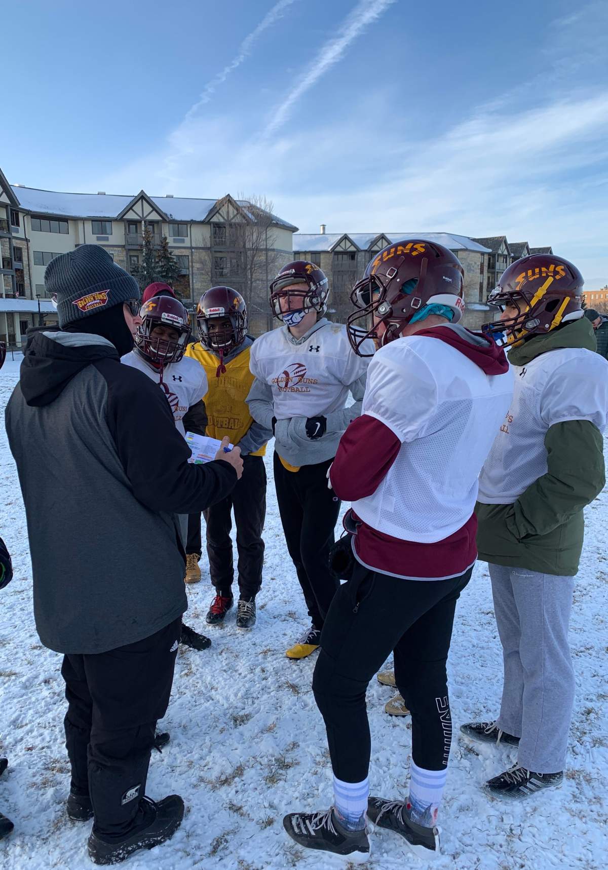 Foord talks the offence through a play during a winter practice at LeBoldus.