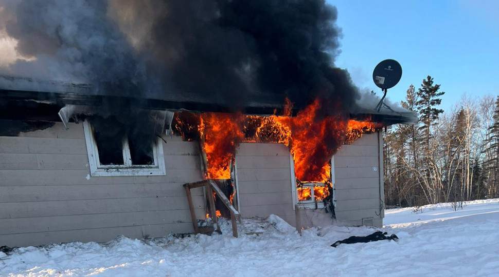 Fire rages at a Moose Lake home.