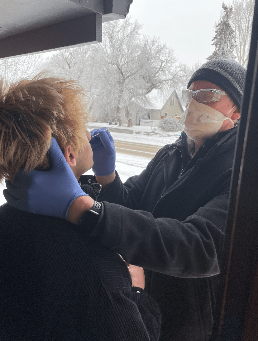 Dr. Keegan performing test on Yates-Laberge's son.