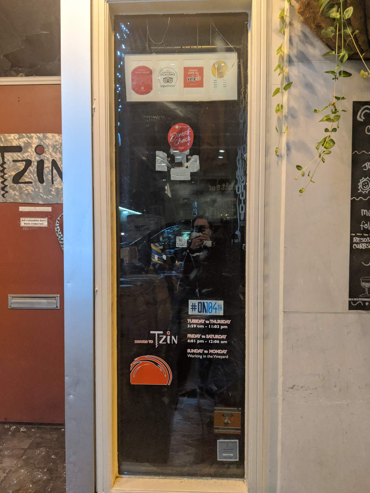 Damage done to Tzin Wine & Tapas in downtown Edmonton during a police arrest in August 2021.