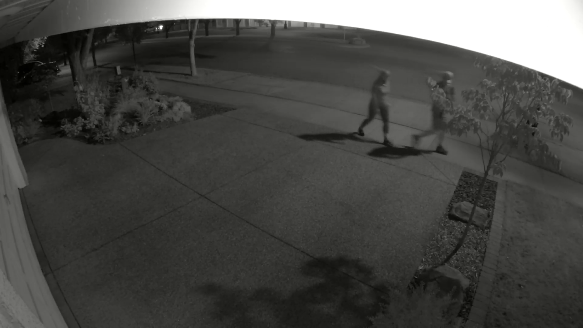 CCTV footage from Aug. 2, 2021, Calgary police believe shows a pair of individuals moments before stealing a turquoise Chevrolet Spark.