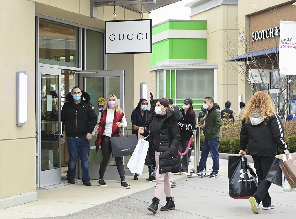 People line up at the Toronto Premium Outlets mall on Black Friday for shopping sales in Milton, Ont., Friday, Nov. 27, 2020. THE CANADIAN PRESS/Nathan Denette.