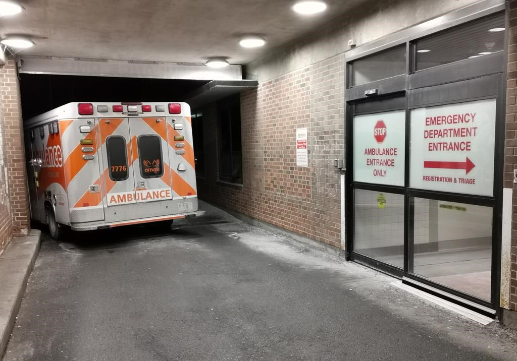 An ambulance is parked at the emergency department at the Lakeridge Health hospital in Bowmanville, Ont. on Wednesday January 12, 2022. 