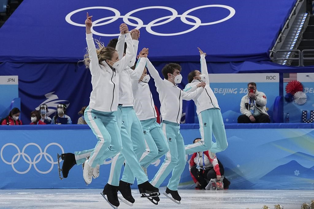 Gold medalists team from the Russian Olympic Committee celebrates following the victory ceremony after the team event in the figure skating competition at the 2022 Winter Olympics, Monday, Feb. 7, 2022, in Beijing. (AP Photo/David J. Phillip).