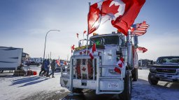 The last truck blocking the southbound lane moves after a breakthrough to resolve the impasse at a protest blockade at the United States border in Coutts, Alta., Wednesday, Feb. 2, 2022.