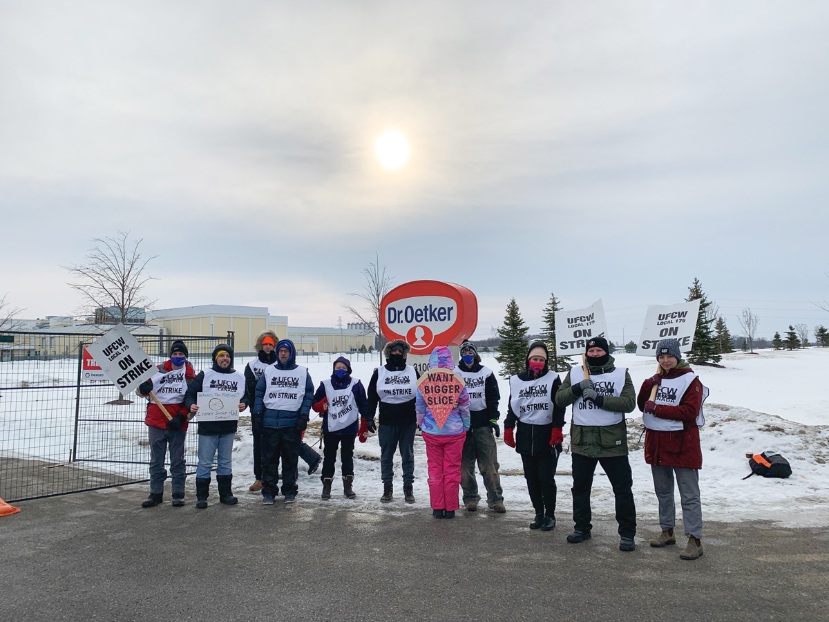 Striking members of UFCW Local 157 outside of the Dr. Oetker plant in London, Ont. on Feb. 16, 2022.