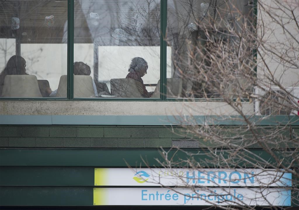 People are shown inside Maison Herron, a long-term care home in the Montreal suburb of Dorval, Que., on Saturday, April 11, 2020. An advocate for seniors in British Columbia says a rise in volunteer services supporting the elderly has been one of the "brightest lights" throughout the pandemic. THE CANADIAN PRESS/Graham Hughes.