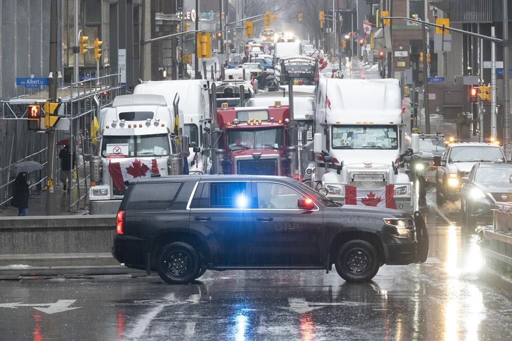 An Ontario Provincial Police vehicle is parked at the ongoing trucker blockade protest in Ottawa, Thursday, Feb. 17, 2022. 