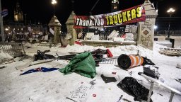 Debris lays on the ground in front of Parliament Hill's gates after police took action to clear the street of trucks and protesters to end a protest, which started in opposition to mandatory COVID-19 vaccine mandates and grew into a broader anti-government demonstration and occupation, on its 23rd day, in Ottawa, Saturday, Feb. 19, 2022. Being able to designate no-go zones, ensure tow trucks were available to remove vehicles and stop the flow of money and goods keeping the demonstrators fed and fuelled are all clear reasons the Emergencies Act was needed to end the Ottawa blockades, Public Safety Minister Marco Mendicino said.