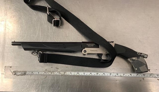 Edmonton police said a sawed-off shotgun was pointed at officers, after they spotted two people not wearing in face coverings inside a downtown convenience store on Monday, Jan. 31, 2022.
