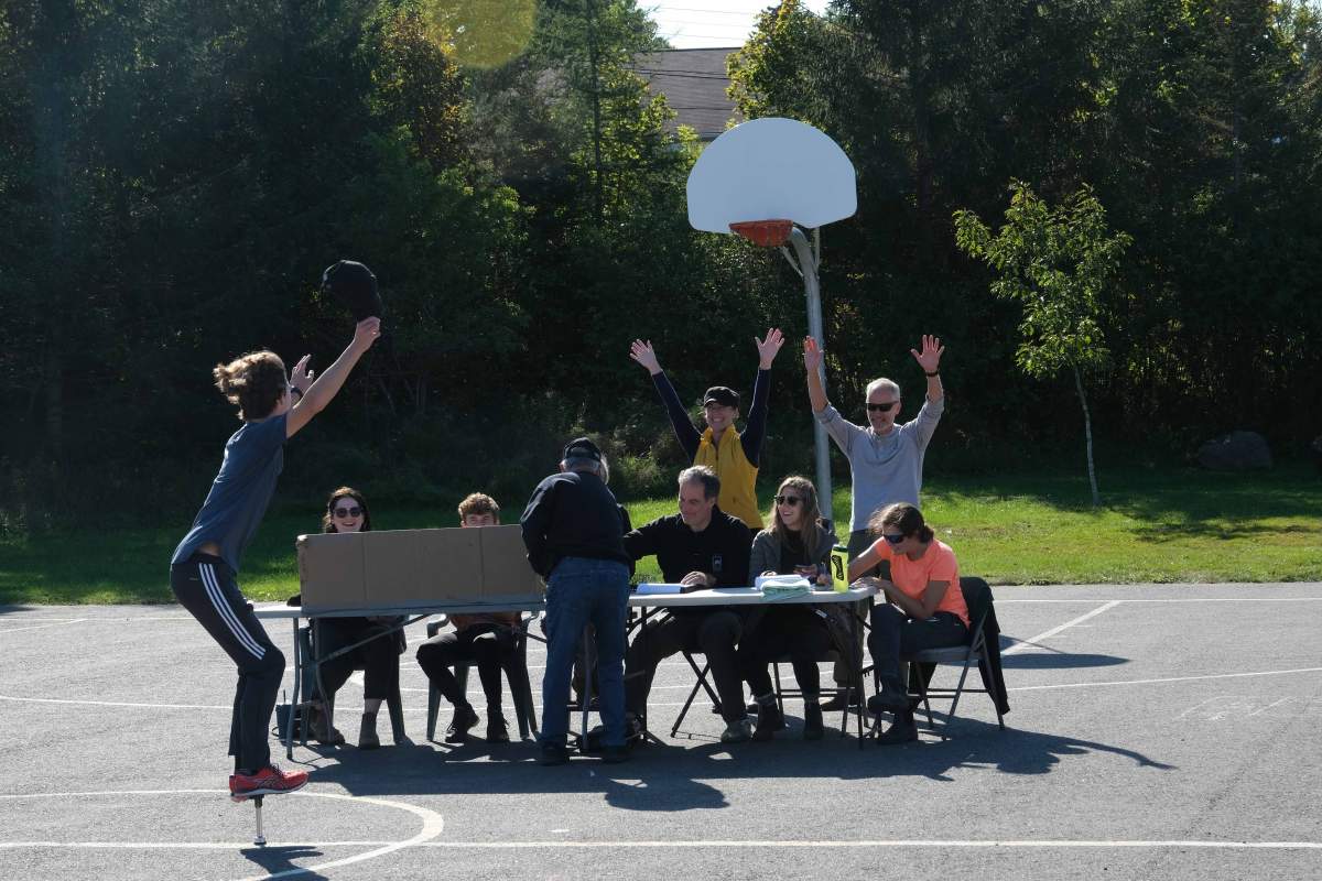 Hafting and his team celebrate after completing his final cube.